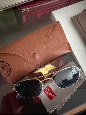 Ray-Ban Women’s Gold Frame Sunglasses with blue Lenses